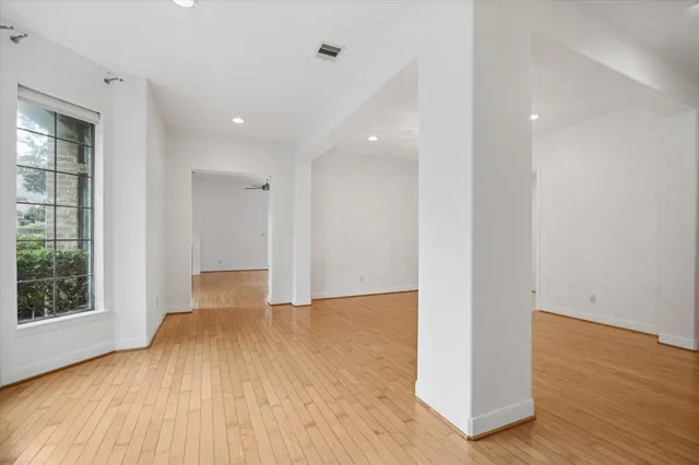 a view of a porch with a table and chairs