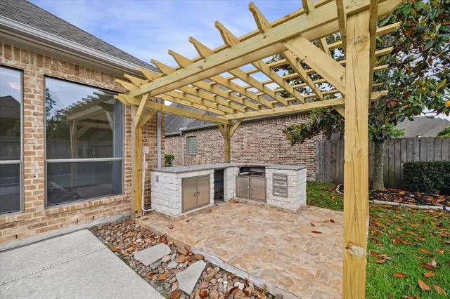 a view of a house with swimming pool and sitting area