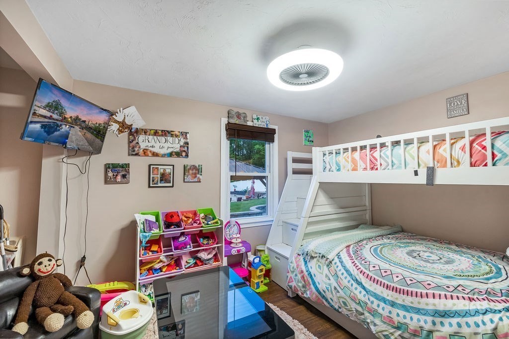 8 New Spencer Road Charlton, MA 01507 - Photo 14 of 42 a bedroom with furniture and a lamp