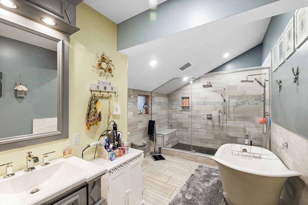 8 New Spencer Road Charlton, MA 01507 - Photo 15 of 42 a bathroom with a sink mirror and shower