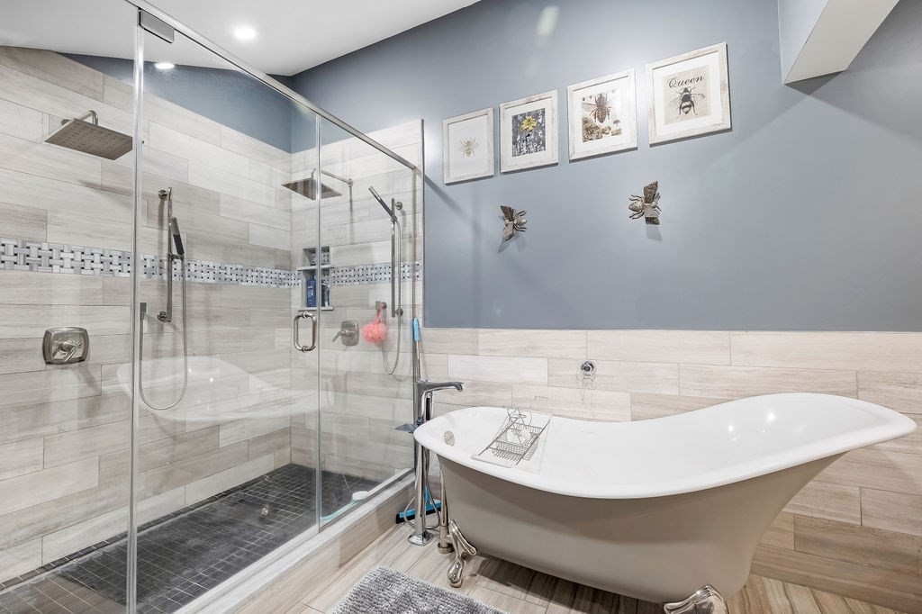 8 New Spencer Road Charlton, MA 01507 - Photo 16 of 42 a bathroom with a bathtub and shower