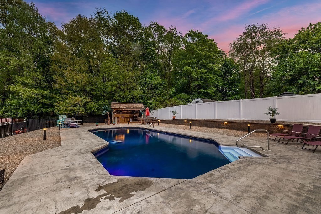 8 New Spencer Road Charlton, MA 01507 - Photo 29 of 42 a swimming pool with outdoor seating and yard