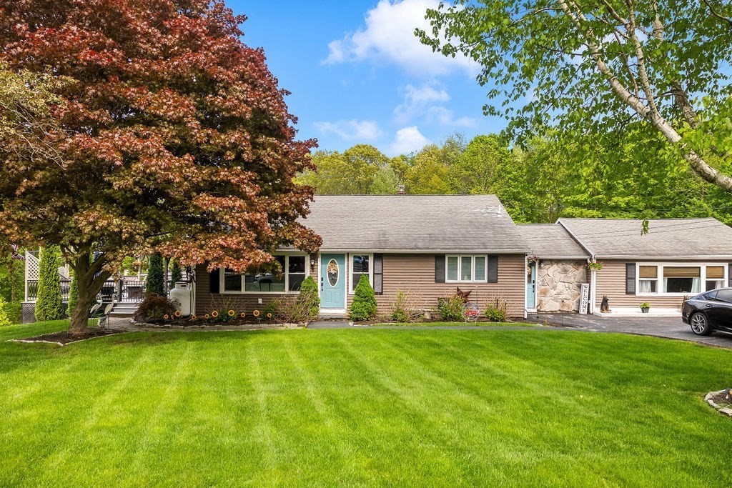 8 New Spencer Road Charlton, MA 01507 - Photo 3 of 42 a front view of house with yard and green space