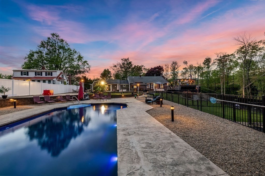 8 New Spencer Road Charlton, MA 01507 - Photo 33 of 42 a view of a swimming pool with an outdoor seating