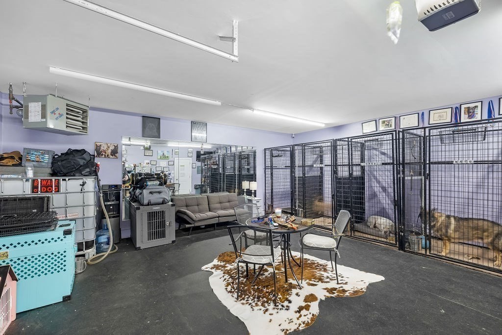 8 New Spencer Road Charlton, MA 01507 - Photo 35 of 42 a living room with lots of furniture a rug and a chandelier