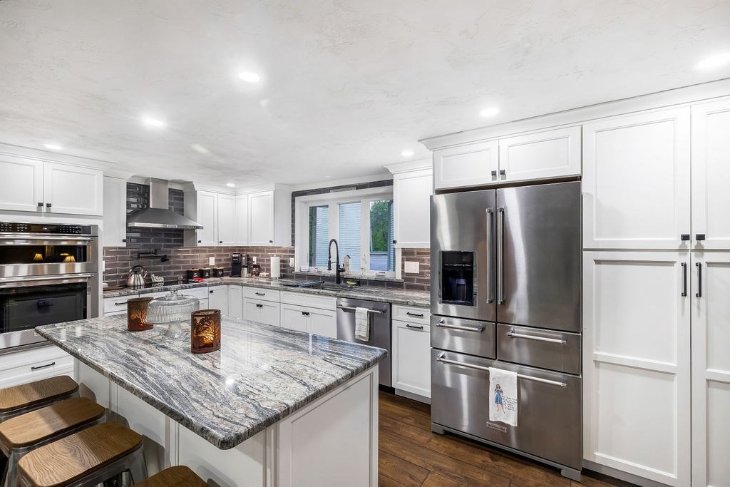 8 New Spencer Road Charlton, MA 01507 - Photo 8 of 42 a kitchen with a refrigerator a stove a sink and a refrigerator
