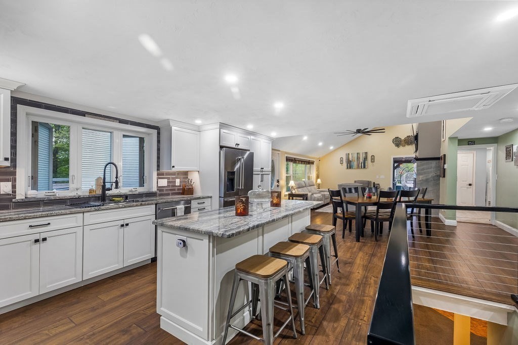 8 New Spencer Road Charlton, MA 01507 - Photo 9 of 42 a large kitchen with lots of counter space a sink and chairs