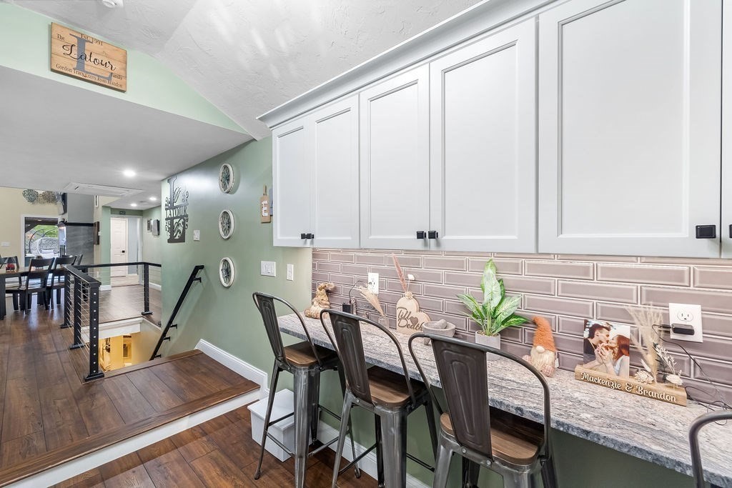 8 New Spencer Road Charlton, MA 01507 - Photo 10 of 42 a view of a dining room with furniture and a potted plant