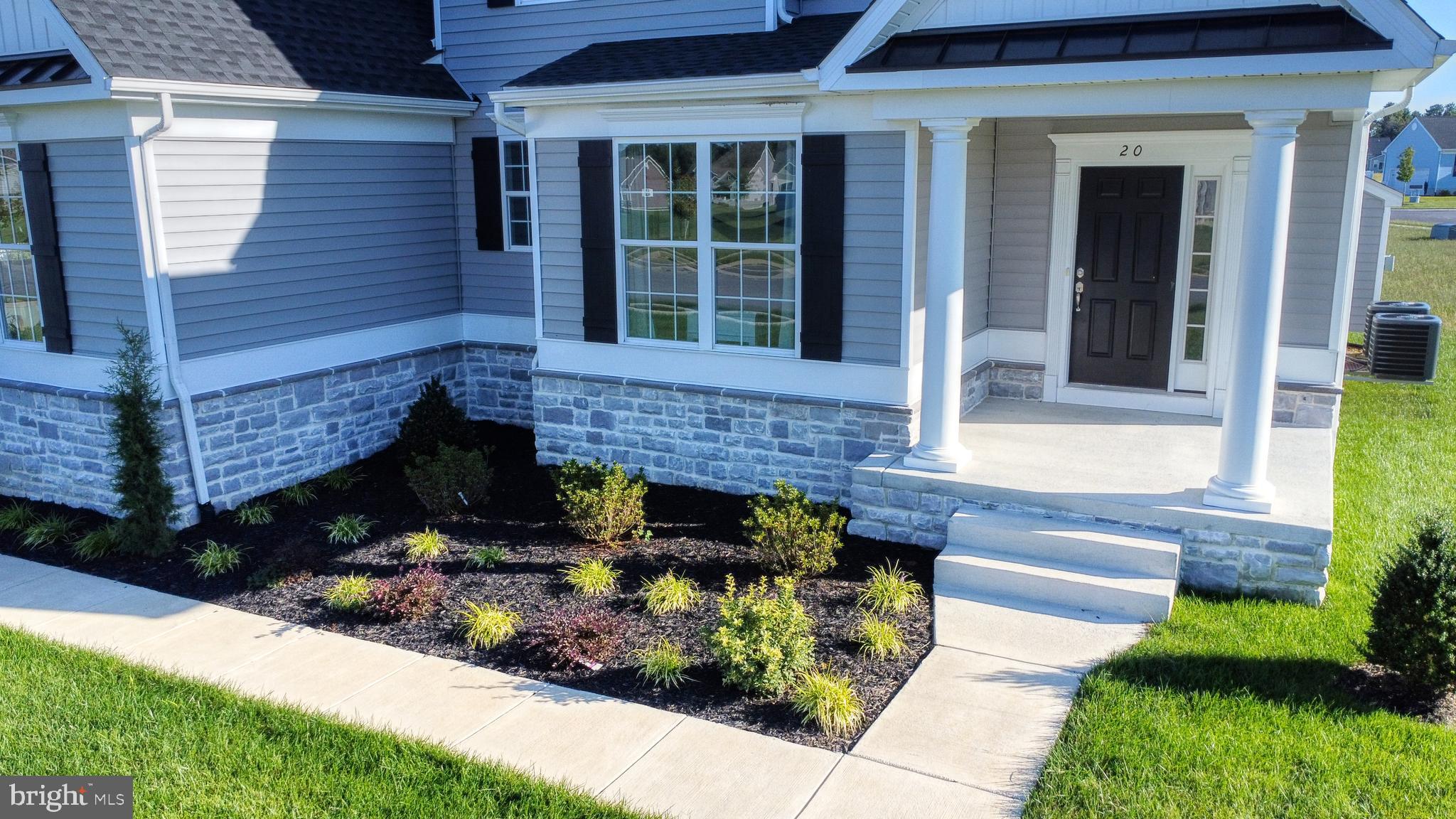 3 Mt Joy Road Millsboro, DE 19966 - Photo 40 of 43 a view of a house with potted plants and a fountain