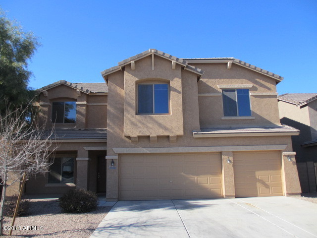 a front view of a house with a garage