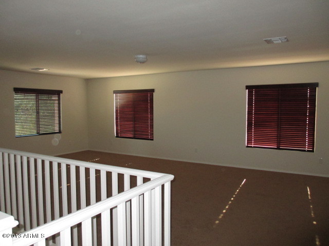 43500 West Magnolia Road Maricopa, AZ 85138 - Photo 15 of 35 a view of an empty room with windows