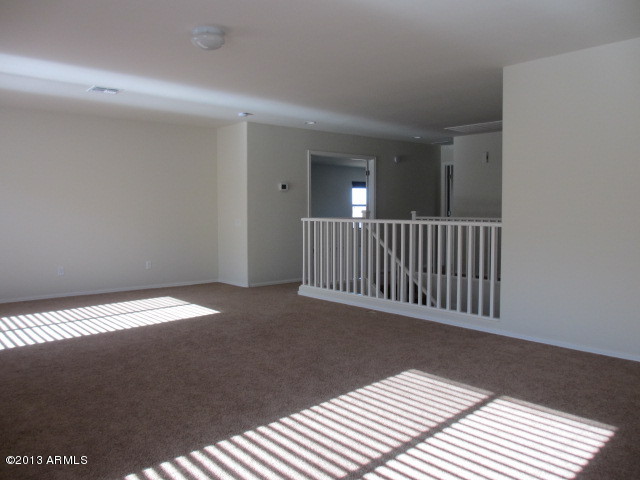 43500 West Magnolia Road Maricopa, AZ 85138 - Photo 16 of 35 a view of a room with wooden floor