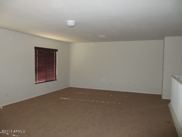 43500 West Magnolia Road Maricopa, AZ 85138 - Photo 17 of 35 an empty room with a workbench