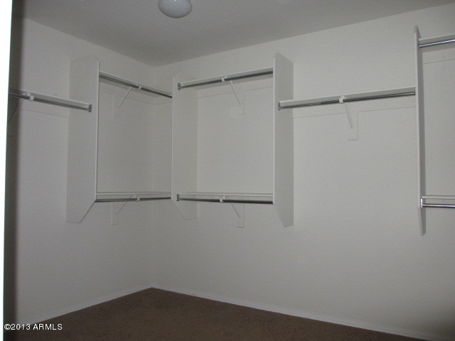 43500 West Magnolia Road Maricopa, AZ 85138 - Photo 22 of 35 a view of an empty walk in closet