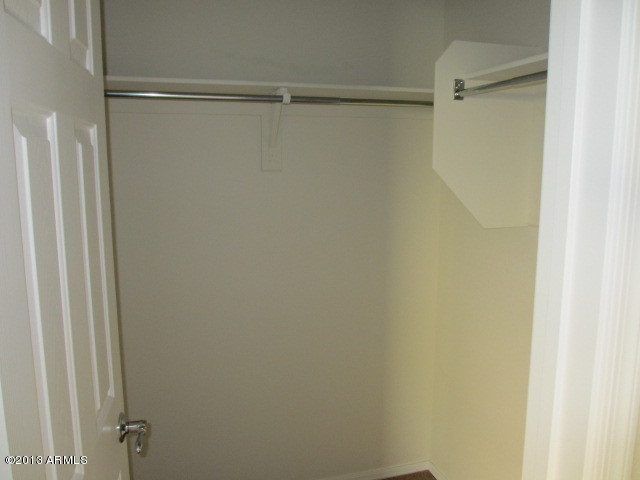43500 West Magnolia Road Maricopa, AZ 85138 - Photo 25 of 35 a bathroom with a glass shower door