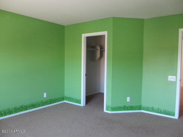 43500 West Magnolia Road Maricopa, AZ 85138 - Photo 27 of 35 a view of a big room with closet and windows