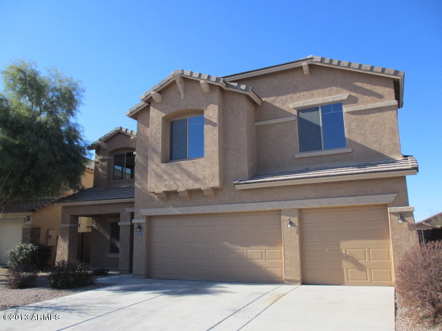 43500 West Magnolia Road Maricopa, AZ 85138 - Photo 3 of 35 a front view of a house with yard