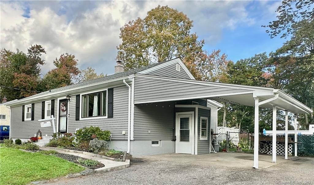 45 Cedar Spring Road Milford, CT 06460 - Photo 1 of 1 a front view of a house with garden