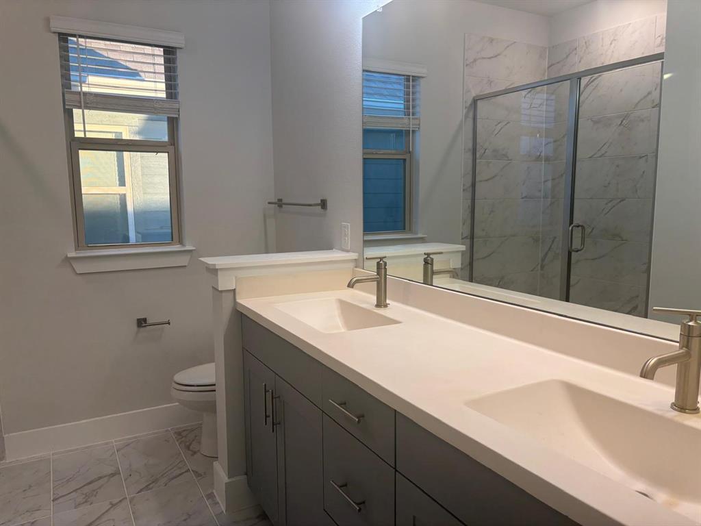 825 West Mayfield Road, Unit 224 Arlington, TX 76015 - Photo 12 of 25 a bathroom with a sink and a vanity