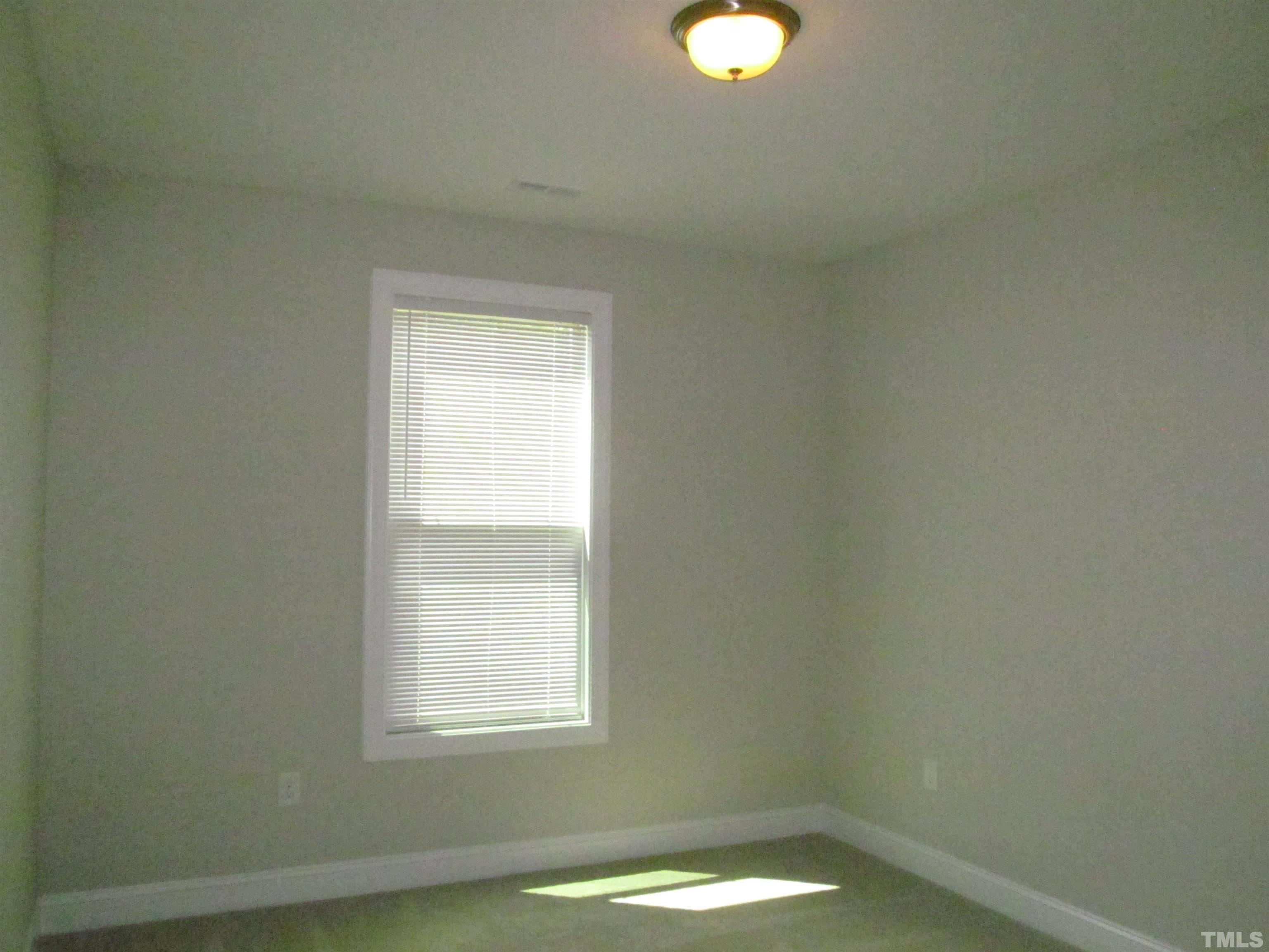1248 Magic Hollow Road Durham, NC 27713 - Photo 8 of 13 a view of a small space with window