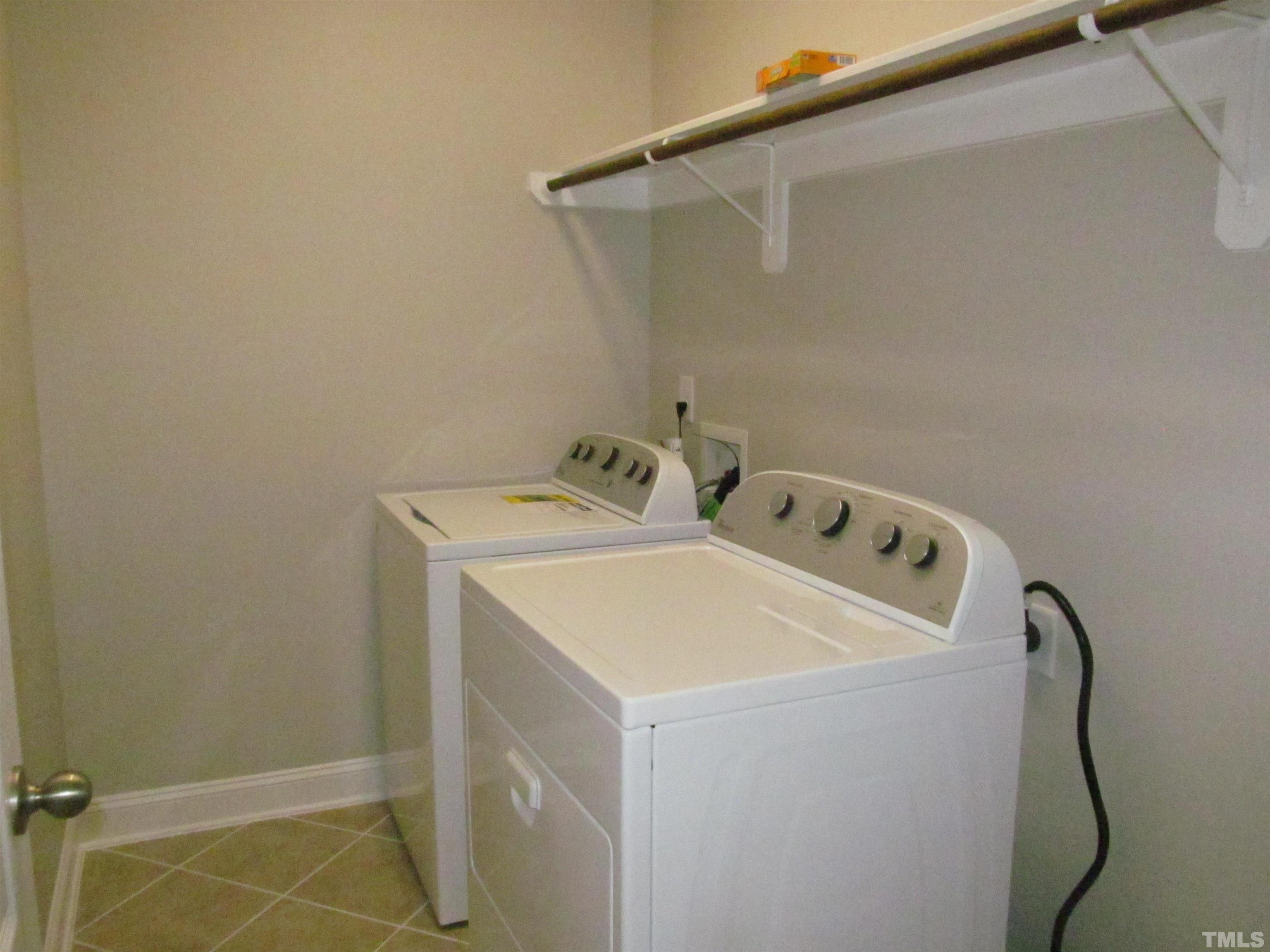 1248 Magic Hollow Road Durham, NC 27713 - Photo 10 of 13 a utility room with dryer and washer