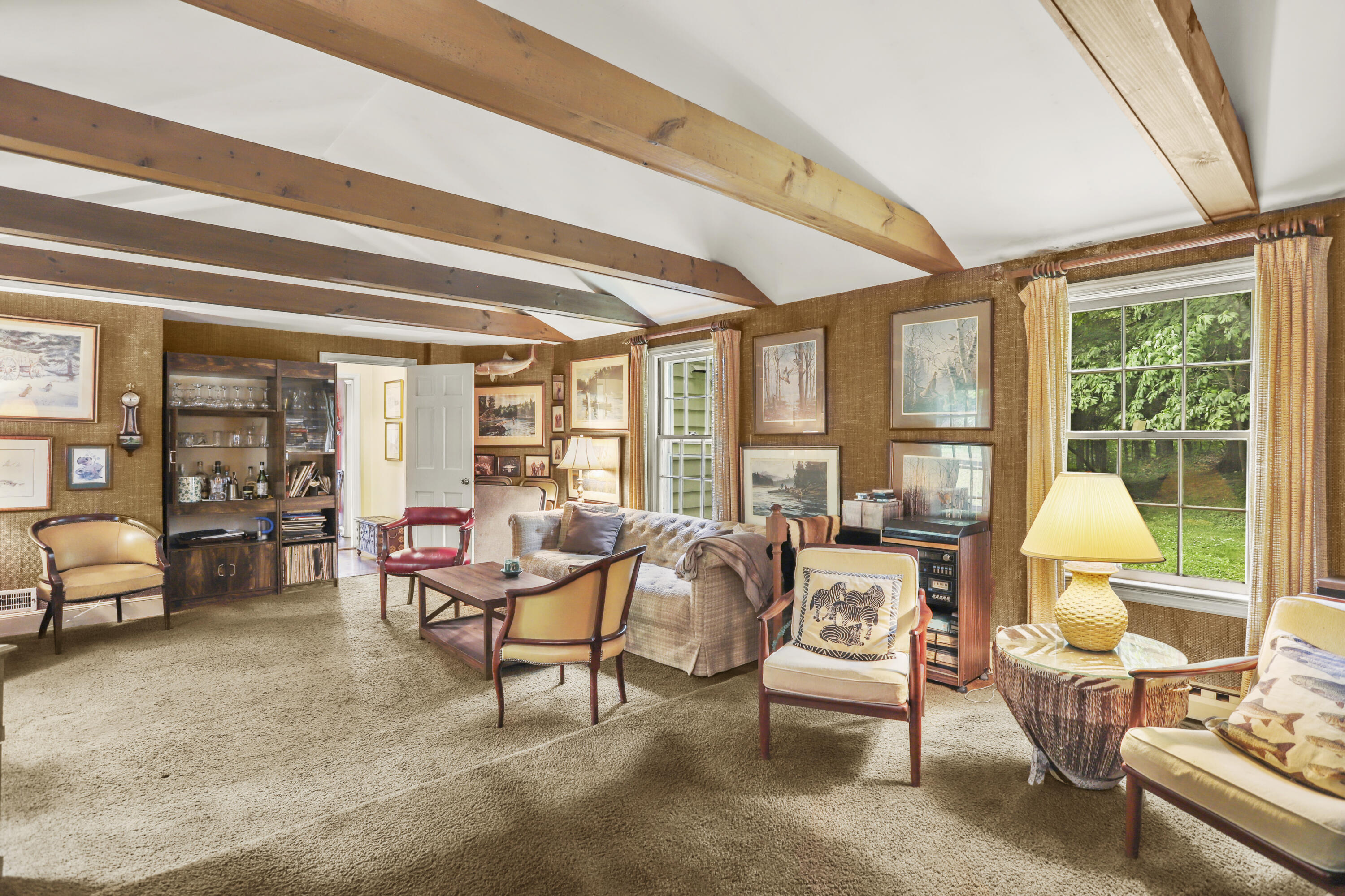 165 Colonial Road New Canaan, CT 06840 - Photo 16 of 37 a living room with furniture and floor to ceiling windows