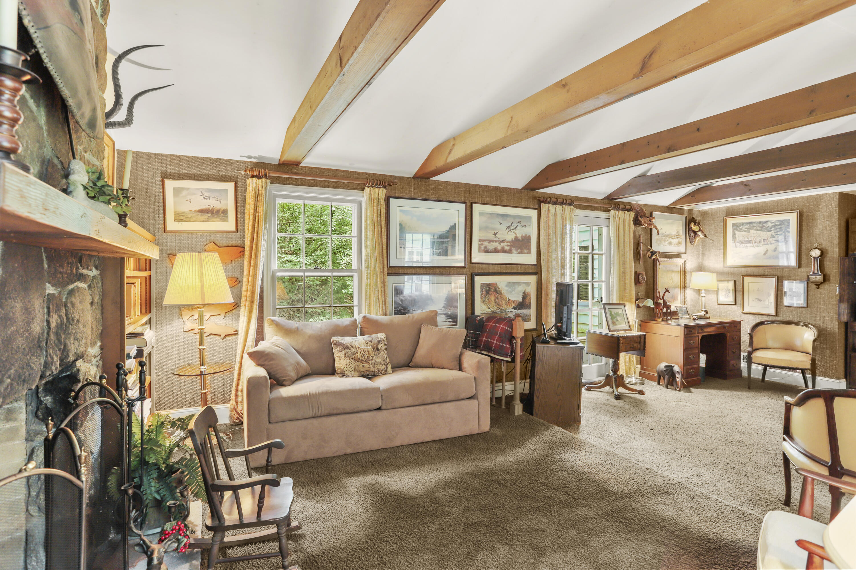 165 Colonial Road New Canaan, CT 06840 - Photo 17 of 37 a living room with furniture and a large window