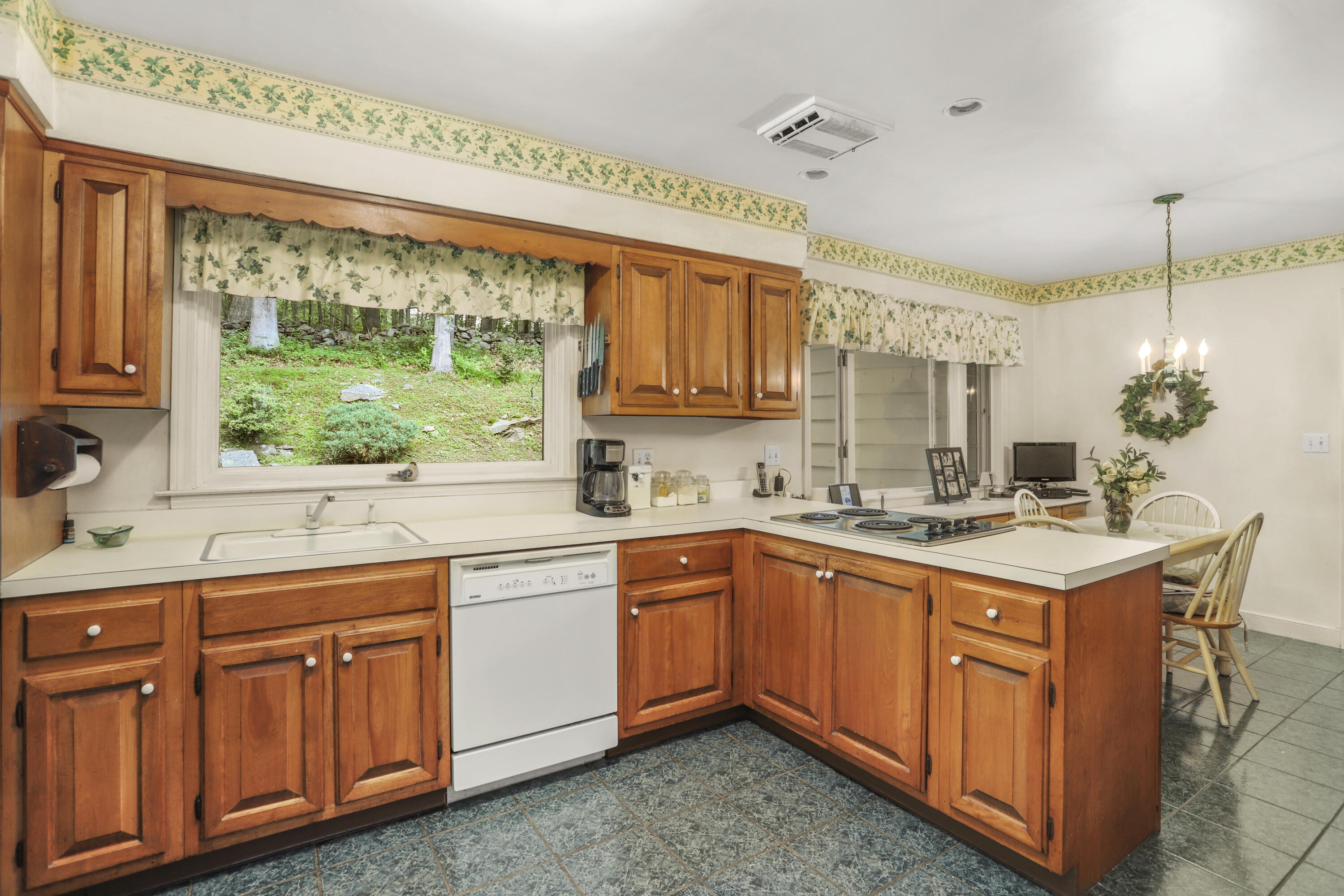 165 Colonial Road New Canaan, CT 06840 - Photo 19 of 37 a kitchen with sink and cabinets