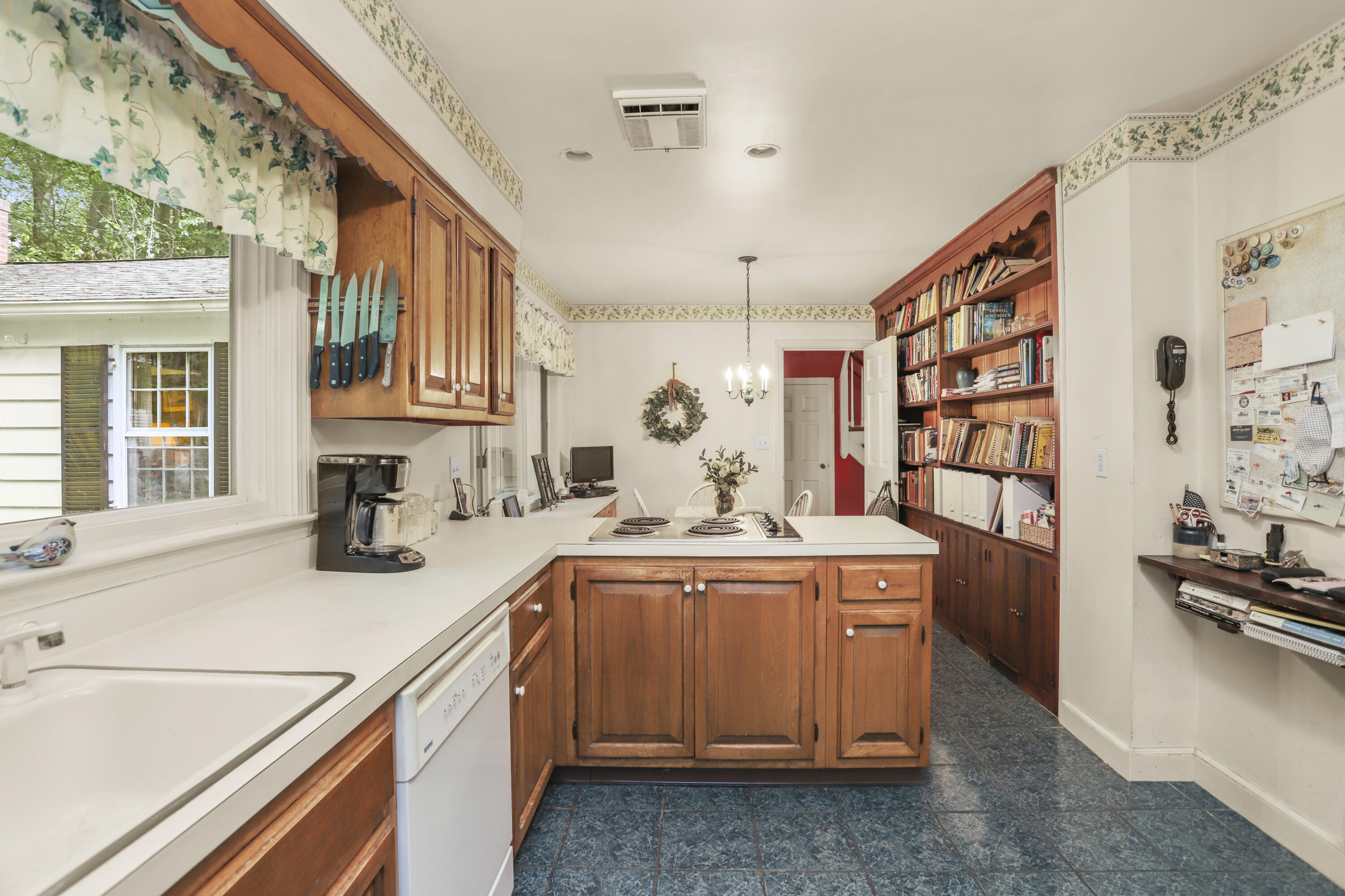 165 Colonial Road New Canaan, CT 06840 - Photo 21 of 37 a kitchen with a sink and cabinets