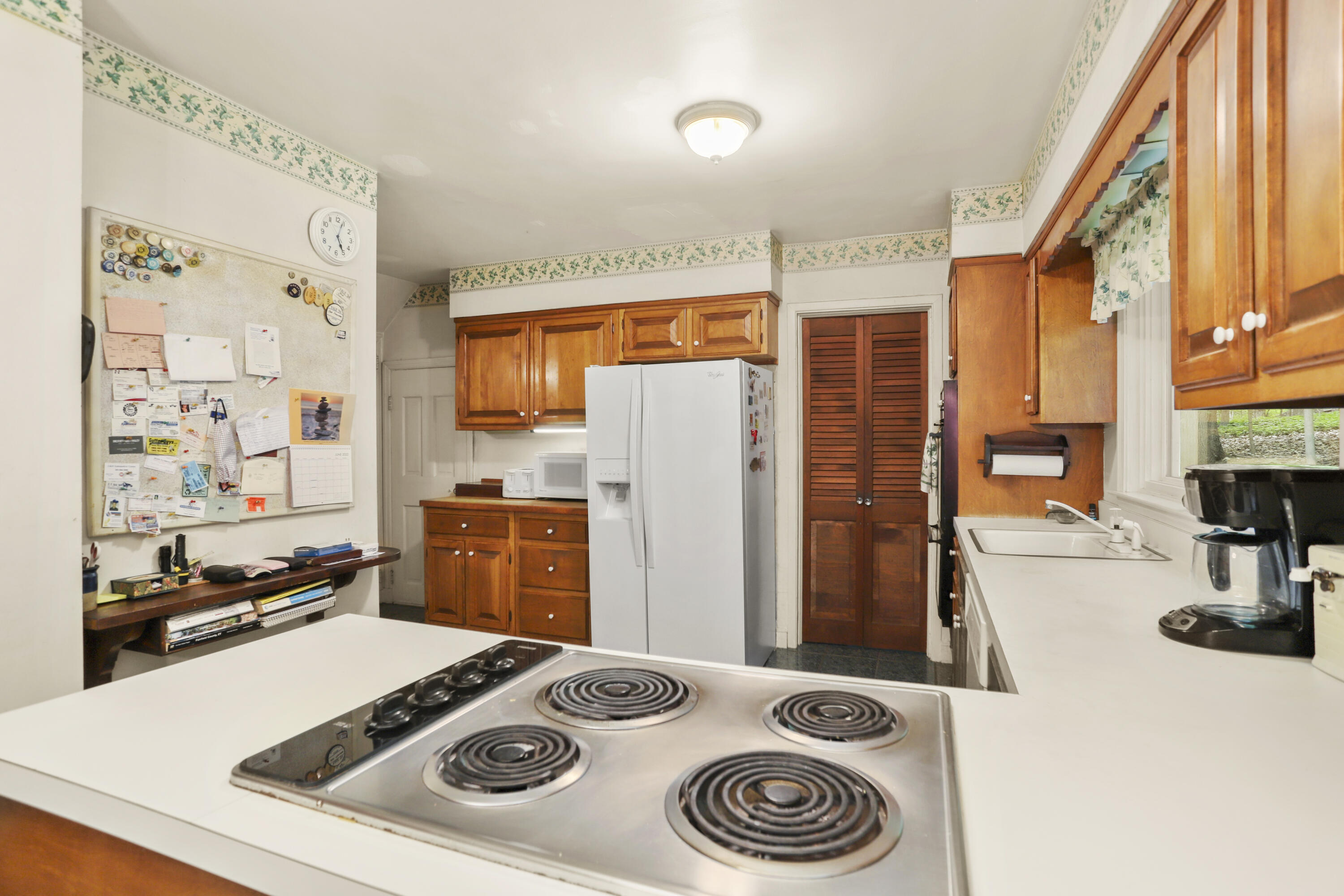 165 Colonial Road New Canaan, CT 06840 - Photo 22 of 37 a kitchen with a stove and a refrigerator