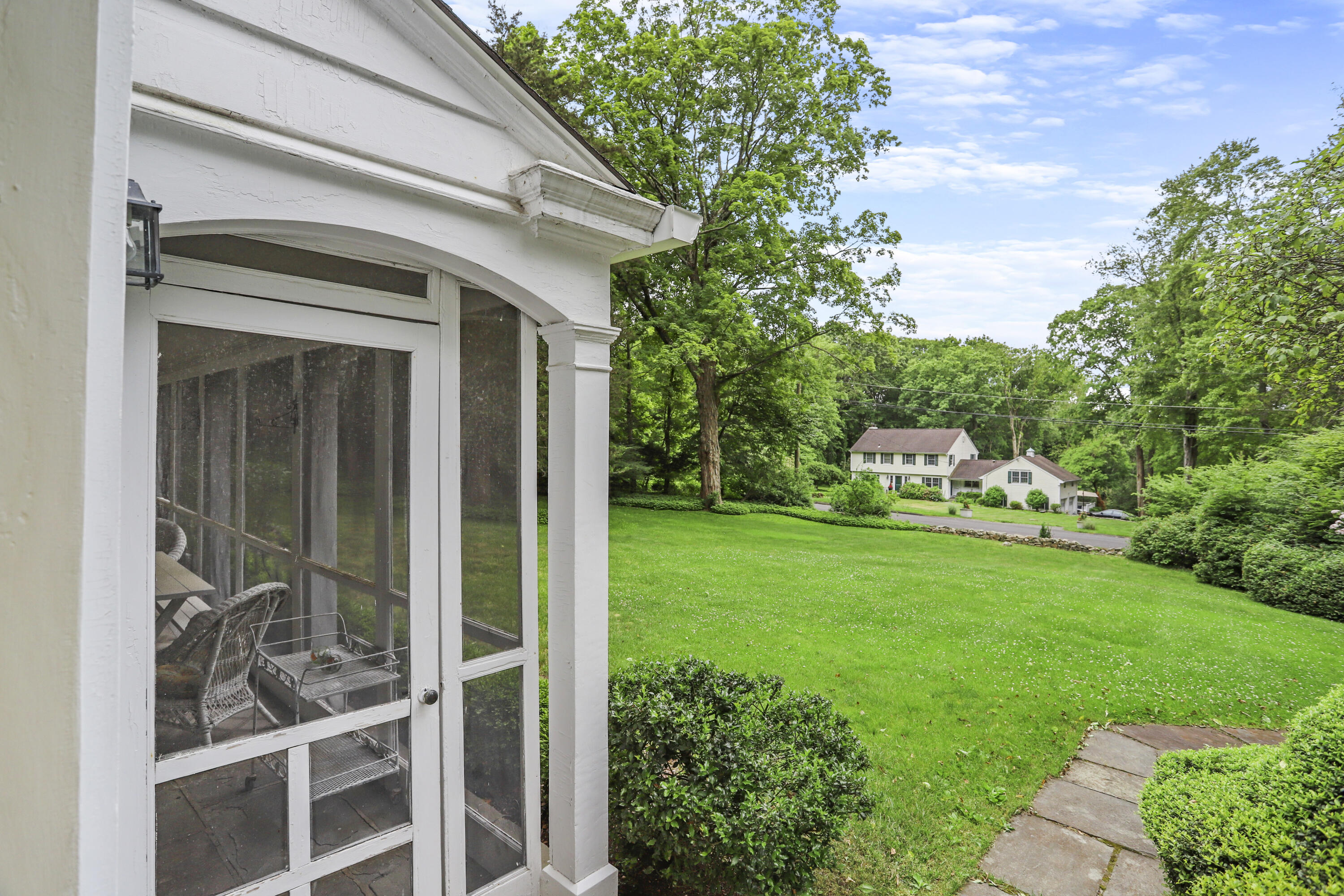 165 Colonial Road New Canaan, CT 06840 - Photo 32 of 37 a view of a back yard of the house