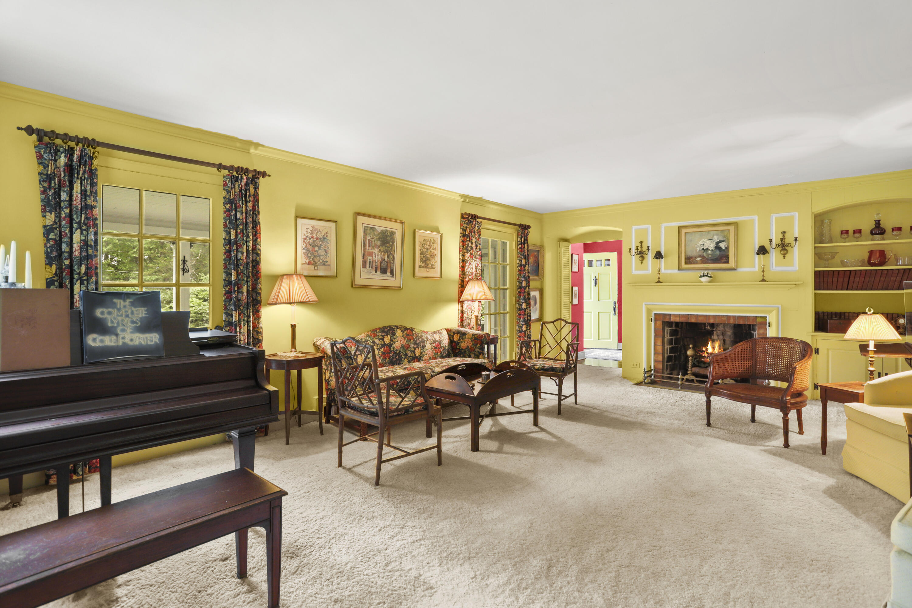 165 Colonial Road New Canaan, CT 06840 - Photo 8 of 37 a living room with furniture a fireplace and a large window