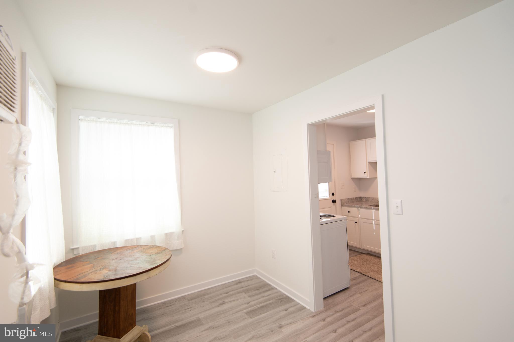 904 Oakley Terrace Cambridge, MD 21613 - Photo 13 of 30 a bathroom with a toilet a sink and mirror
