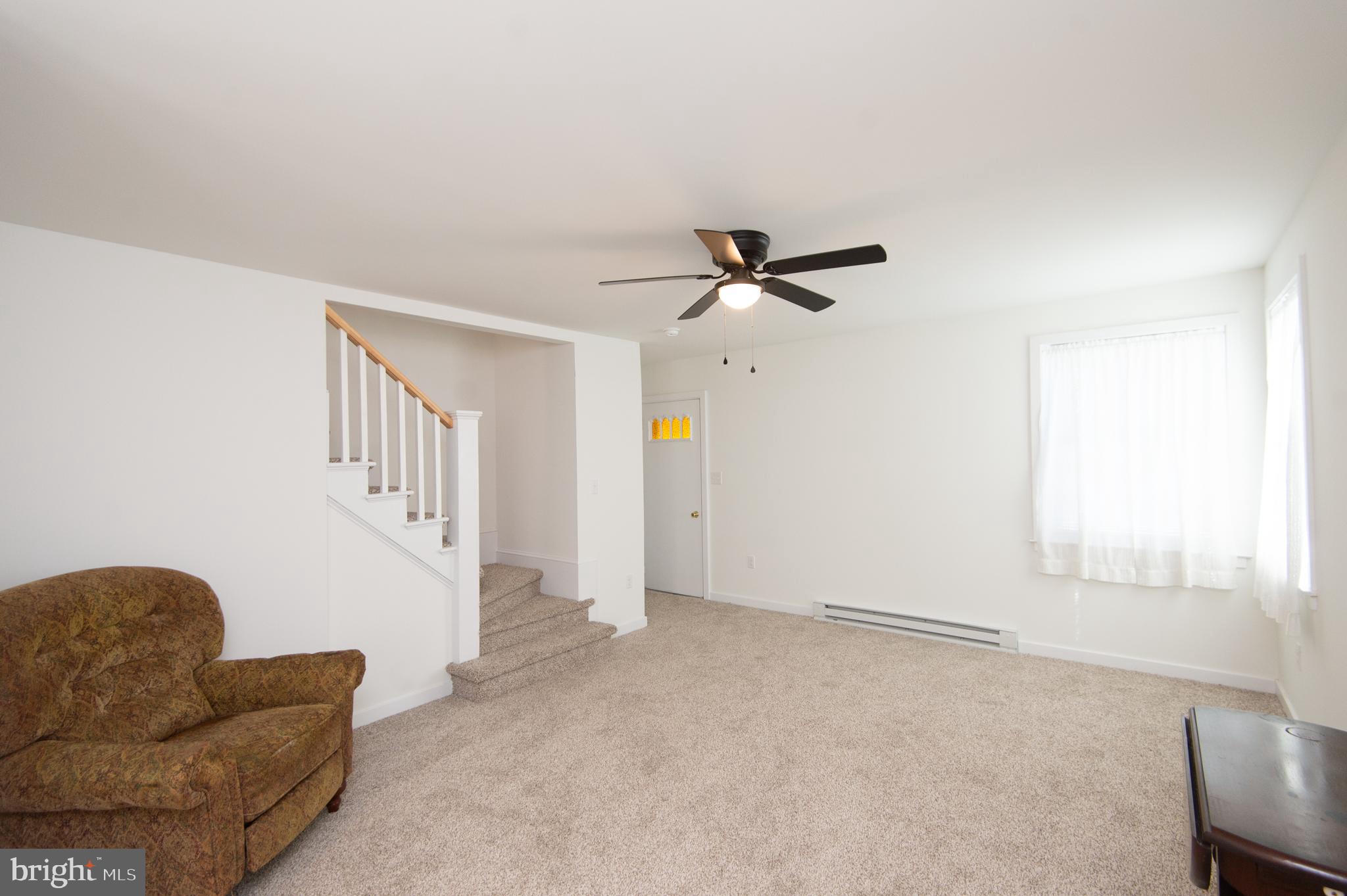 904 Oakley Terrace Cambridge, MD 21613 - Photo 15 of 30 a living room with furniture and a window