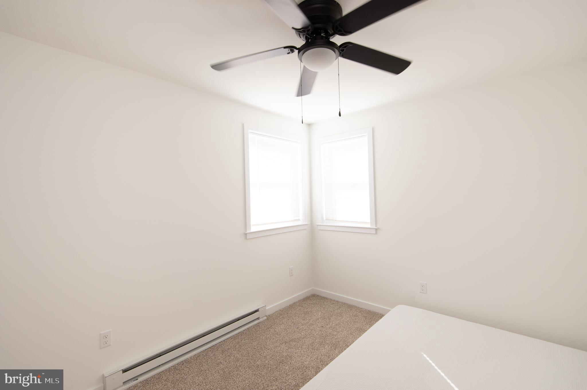 904 Oakley Terrace Cambridge, MD 21613 - Photo 17 of 30 an empty room with a window and a fan