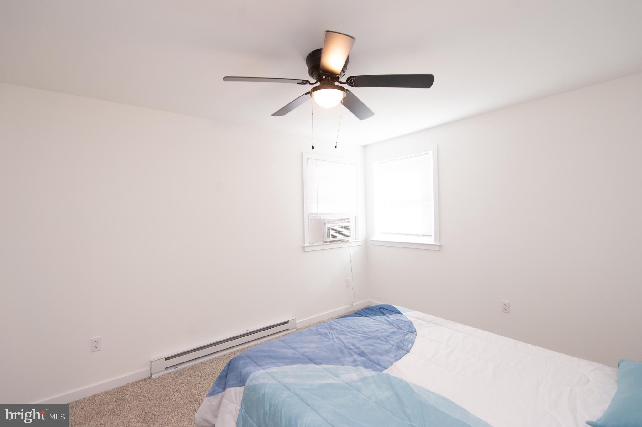 904 Oakley Terrace Cambridge, MD 21613 - Photo 19 of 30 a bedroom with a bed and a window