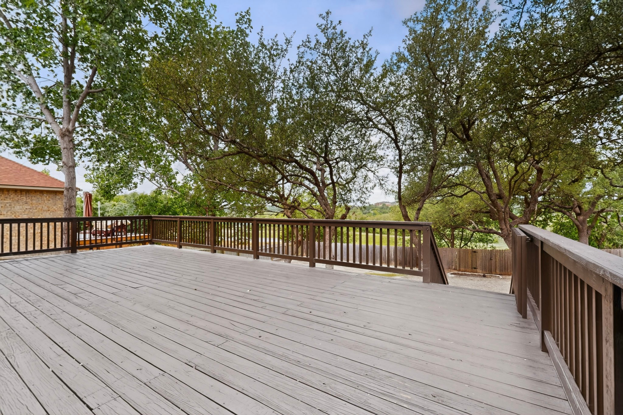 8617 Cobblestone Austin, TX 78735 - Photo 34 of 39 a view of balcony with wooden floor and fence