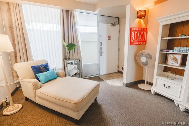 a spacious bedroom with a bed and a window