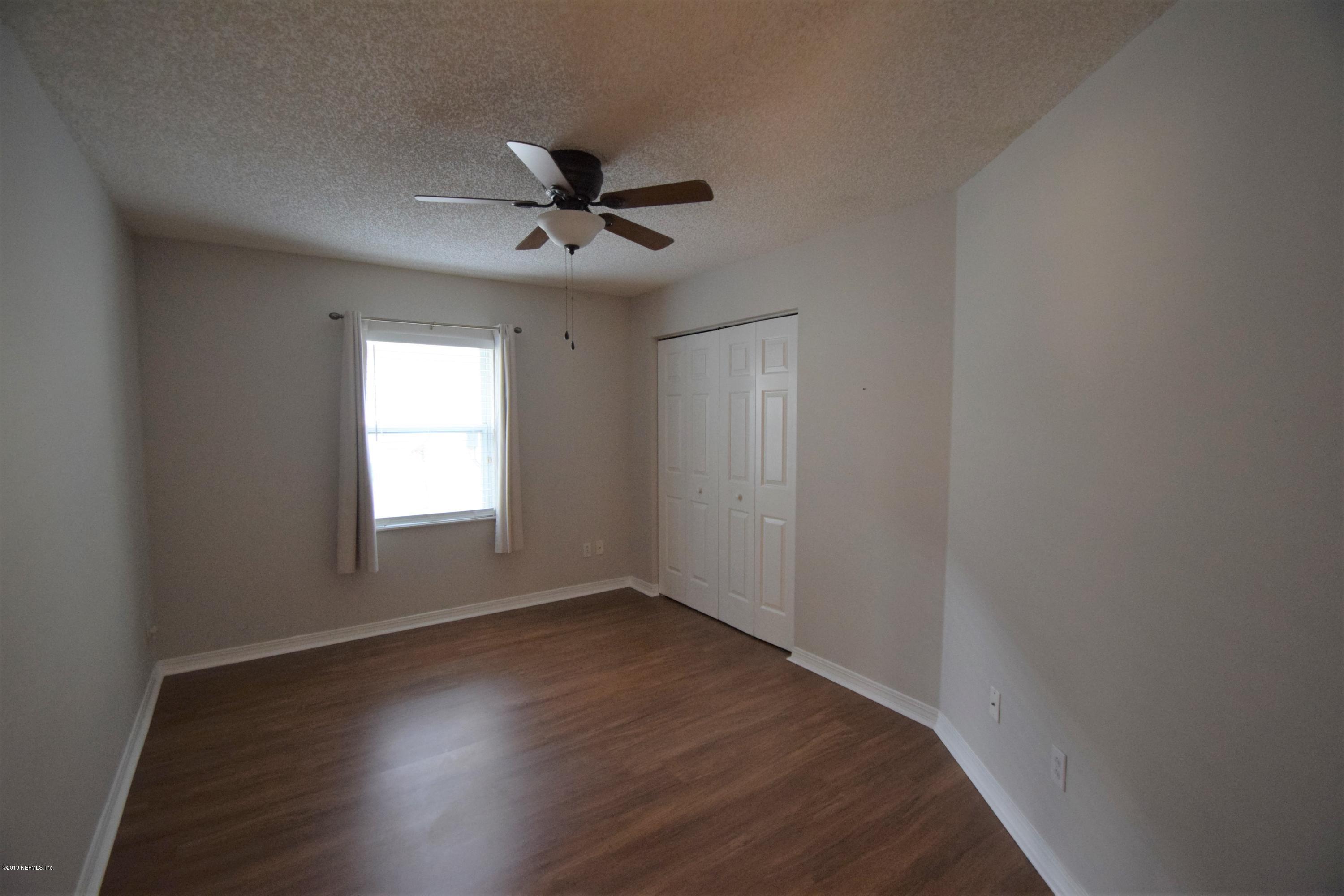 805 Sugarcane Avenue St. Augustine, FL 32095 - Photo 15 of 20 a view of empty room with wooden floor and fan
