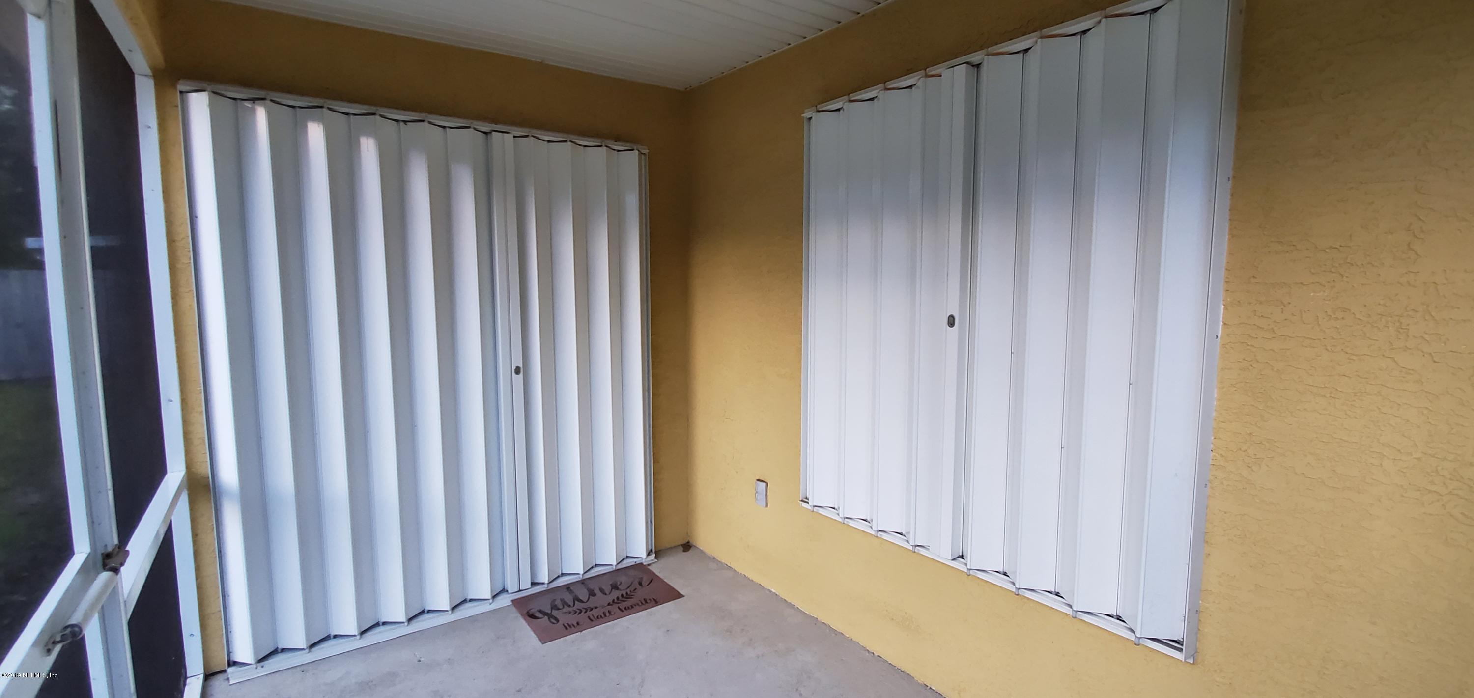 805 Sugarcane Avenue St. Augustine, FL 32095 - Photo 17 of 20 a view of a room with wooden walls