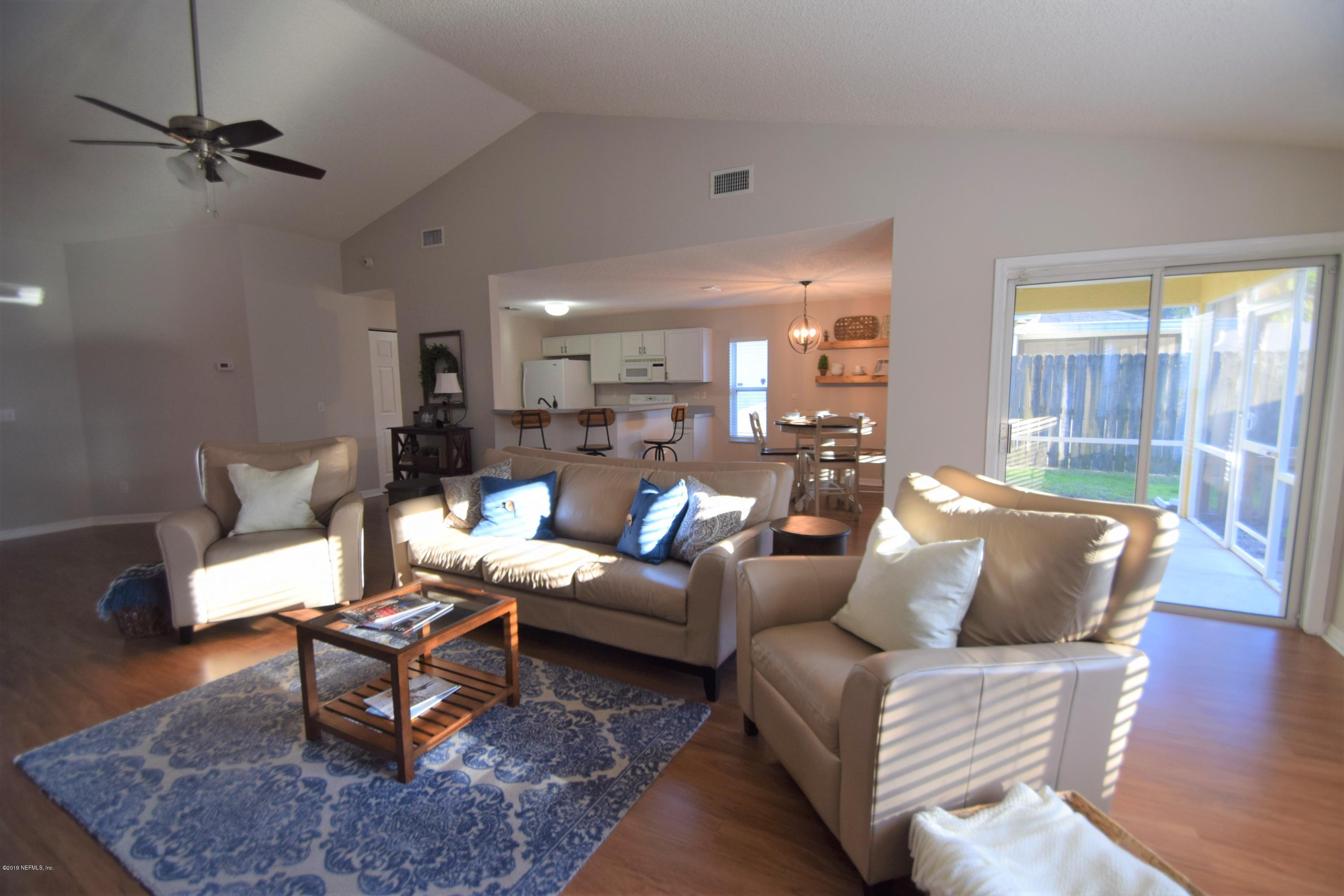 805 Sugarcane Avenue St. Augustine, FL 32095 - Photo 5 of 20 a living room with furniture and wooden floor