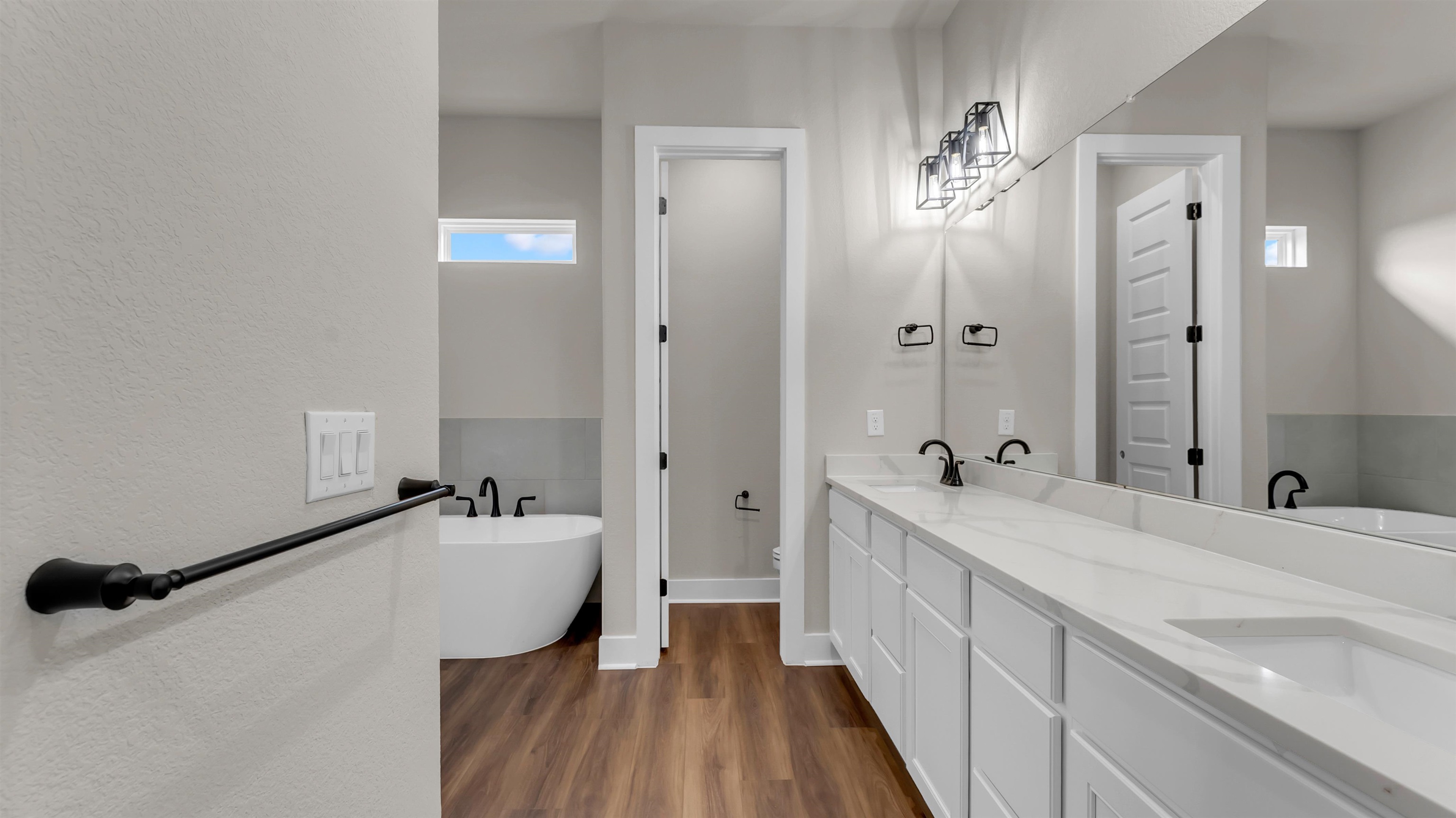 379 Prarie Point Road Bertram, TX 78605 - Photo 19 of 30 a spacious bathroom with a tub sink and mirror