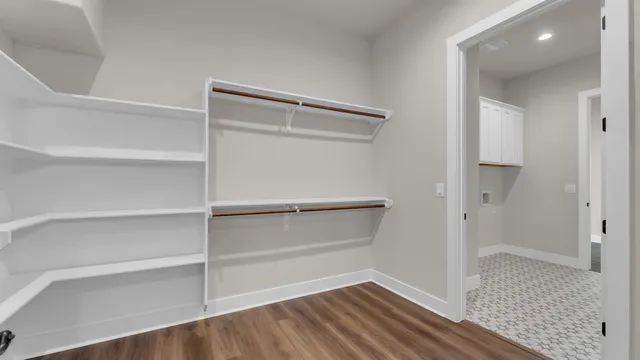 a bathroom with a toilet and a bath tub