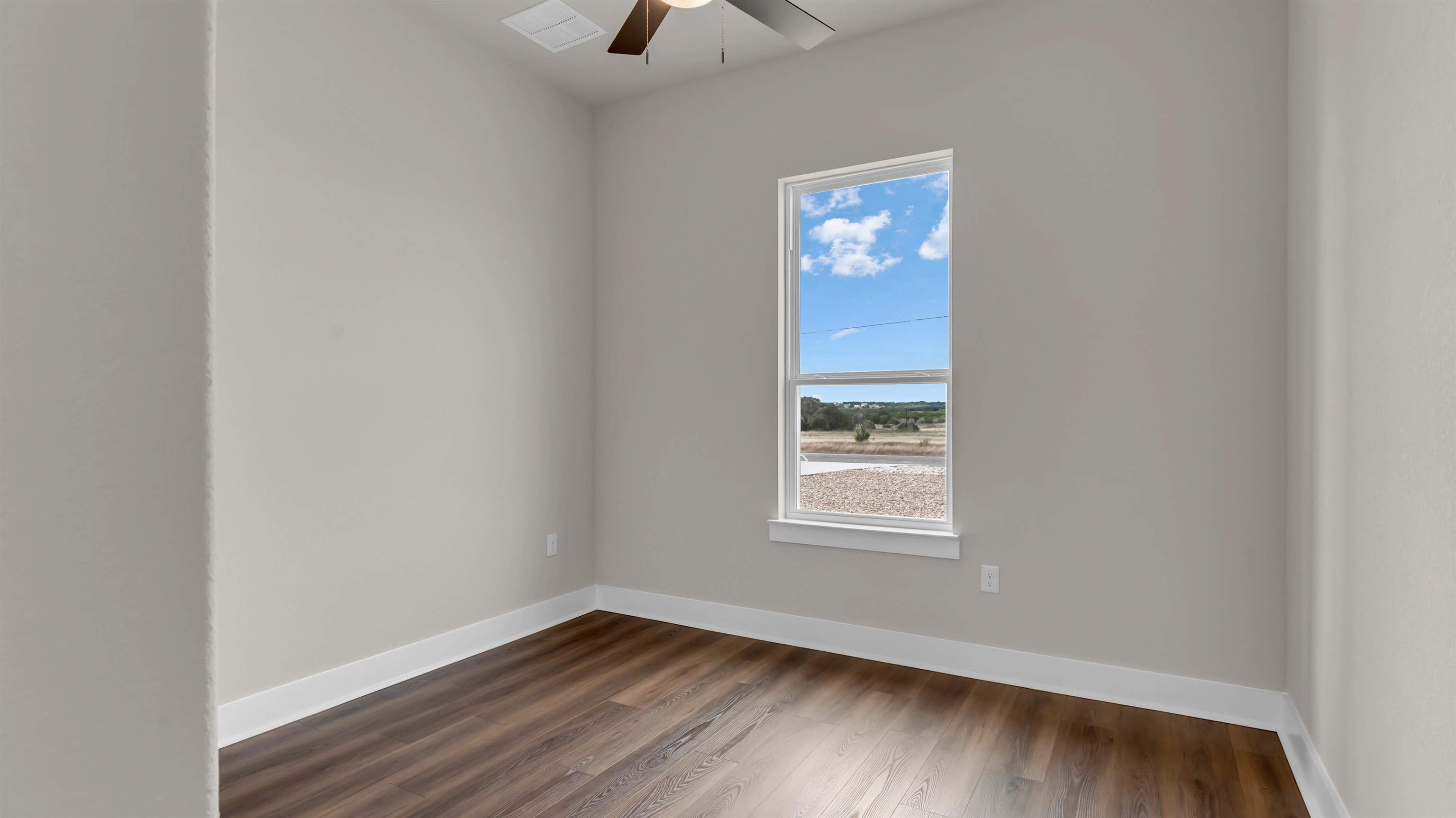 379 Prarie Point Road Bertram, TX 78605 - Photo 24 of 30 an empty room with a window