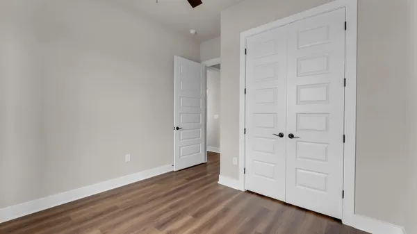 a bathroom with a toilet and a bath tub