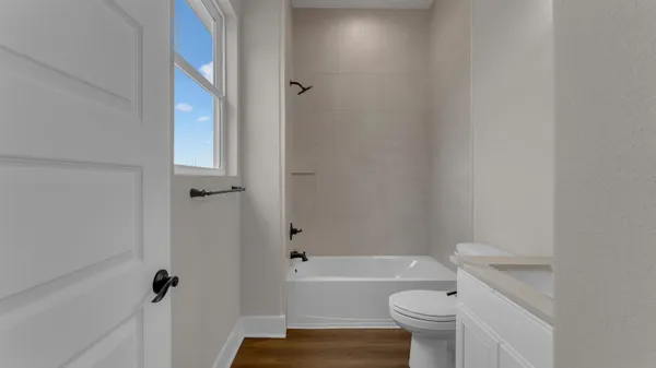 a bathroom with a sink toilet and bathtub