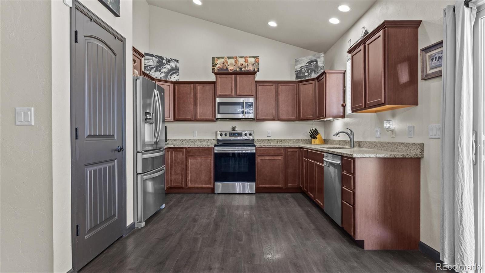 556-32 32 5/8 Road Clifton, CO 81520 - Photo 11 of 28 a kitchen with a sink a counter top space stainless steel appliances and cabinets