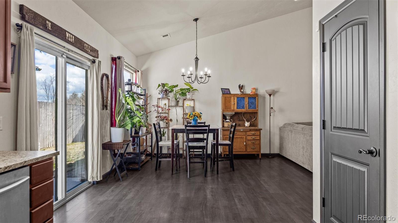 556-32 32 5/8 Road Clifton, CO 81520 - Photo 13 of 28 a dining room with furniture and wooden floor