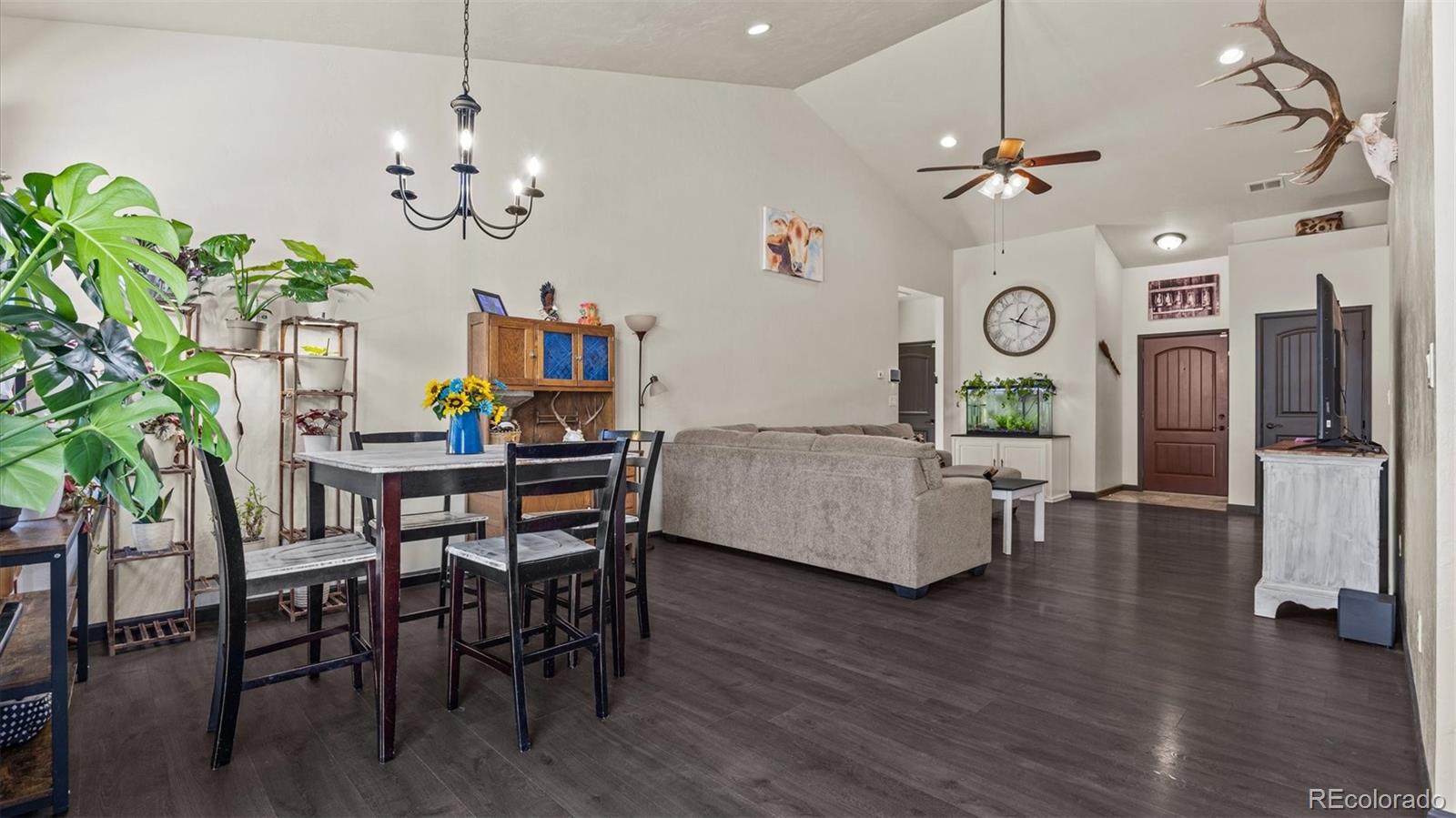 556-32 32 5/8 Road Clifton, CO 81520 - Photo 14 of 28 a living room with furniture and a chandelier