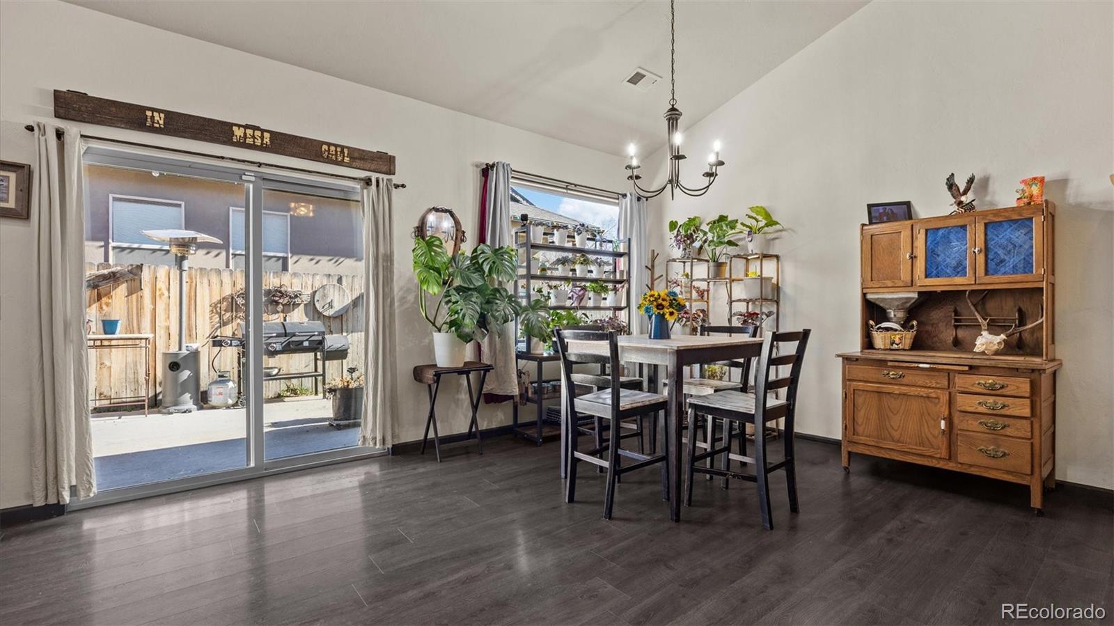 556-32 32 5/8 Road Clifton, CO 81520 - Photo 15 of 28 a view of a dining room with furniture window and wooden floor